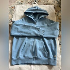 Vuori Restore Full Zip hoodie in the color “spring” blue.